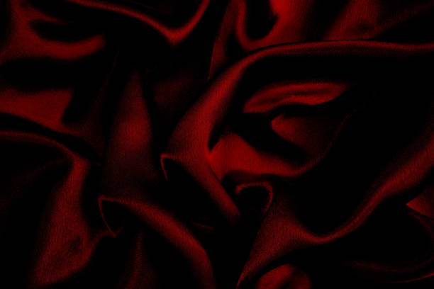istock Background of draped red satin fabric. 1403638333