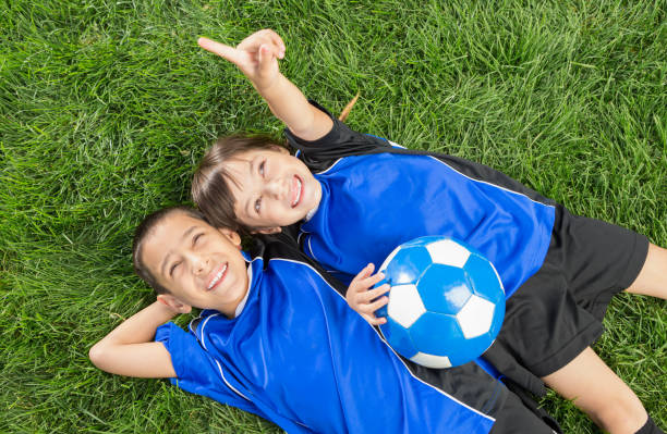 istock Happy Sibling soccer portrait 1403638379