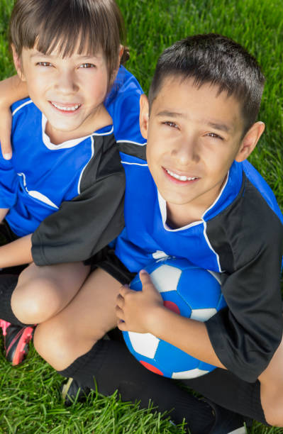 istock Happy Sibling soccer portrait 1403638553