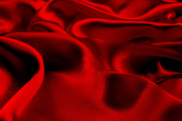 istock Background of draped red satin fabric. 1403638588