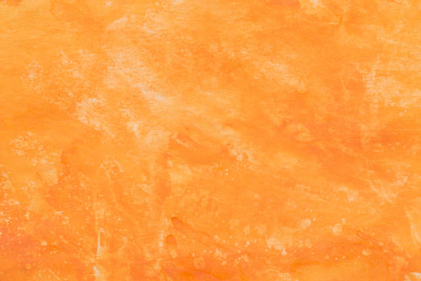 istock orange painted watercolor background texture 1403638764