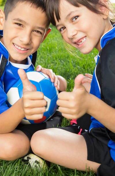 istock Happy Sibling soccer portrait 1403638798