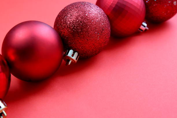 istock Christmas balls lie in one line on a red background. 1403640885