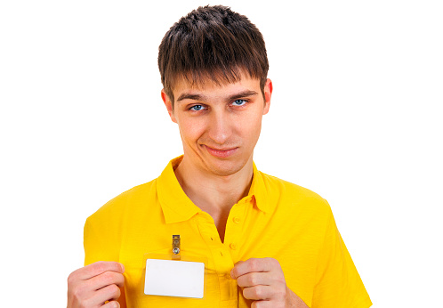 Displeased Young Man with Empty Badge on a Shirt on the White Background