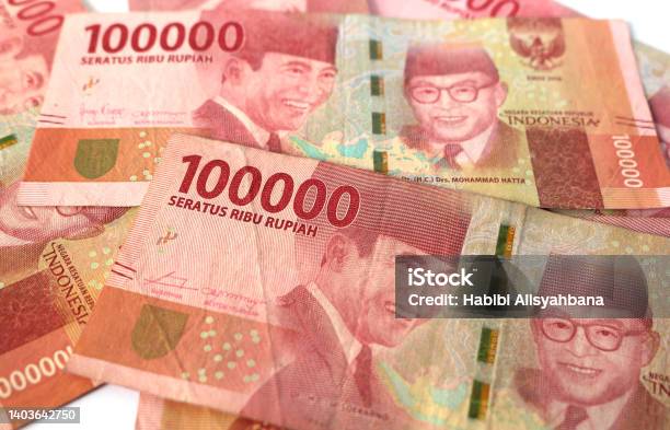 Indonesia Banknotes Of 100000 Rupiah Isolated On White Background Stock Photo - Download Image Now