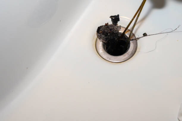 istock Close up of a dirty bathroom clogged sink 1403643511