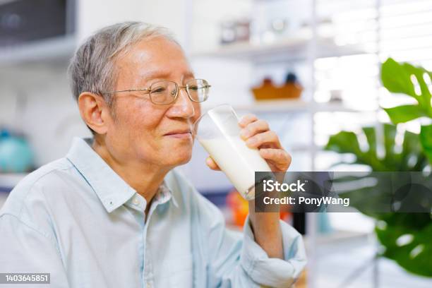 Senior Man Drinks Milk Stock Photo - Download Image Now - Milk, Drinking, Men