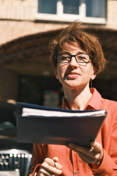 istock Woman waiting for the coworker to pass the documents 1403646885