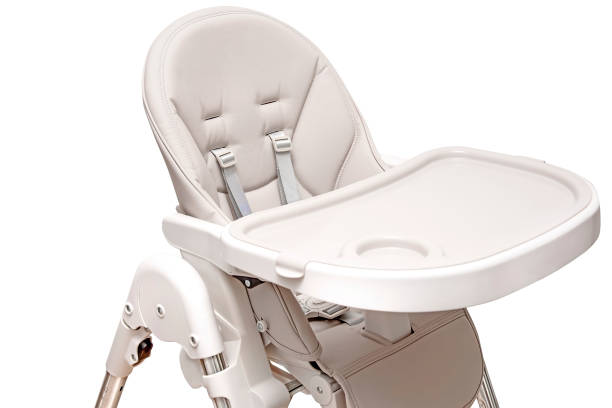 istock Child high chair eating 1403652229