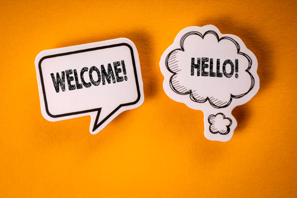 istock Welcome. Speech bubbles with text on an orange background 1403652752
