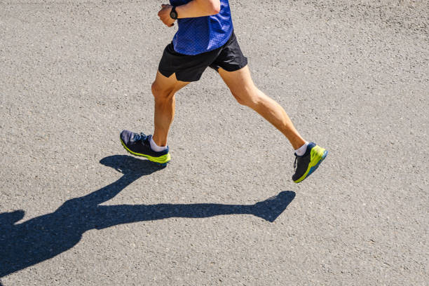 istock legs male runner running race on asphalt 1403657486
