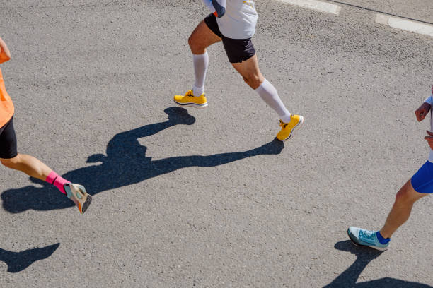 istock legs runners athletes run marathon race top view 1403657497