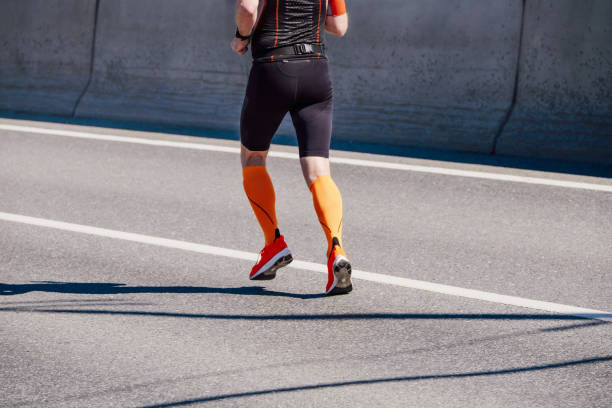 istock male athlete in compression socks running marathon 1403657498