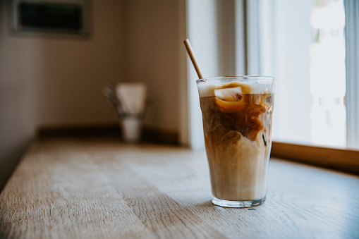 Iced latte on the wooden table