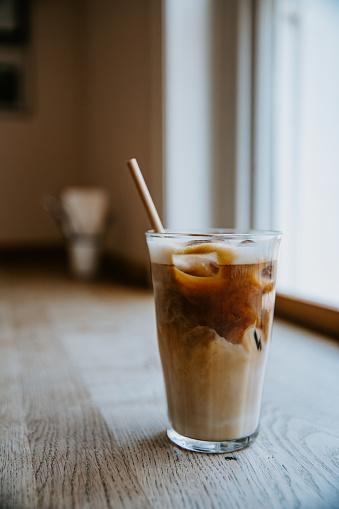 Iced latte on the wooden table