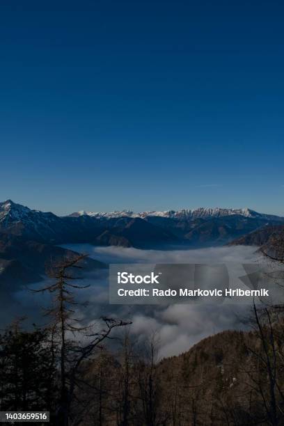 View On Kamniksavinja Alps Over The Foggy Valley From Krvavec Ski Resort Gorenjska Region Slovenia Stock Photo - Download Image Now