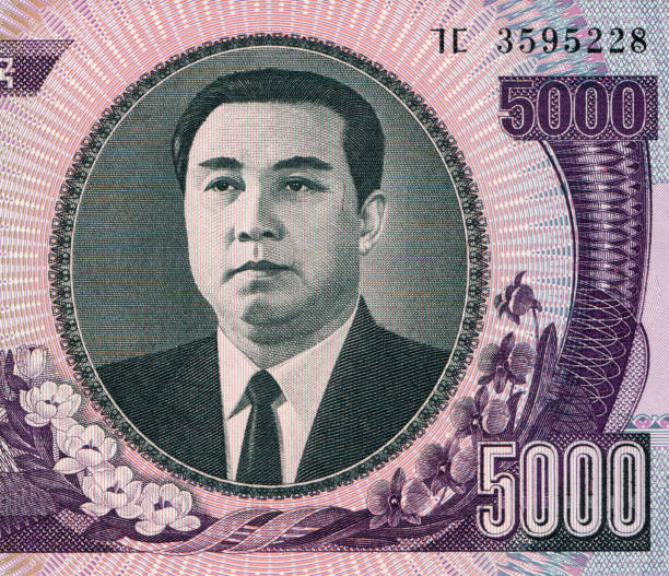 istock Kim il-sung Portrait Pattern Design on North Korea Banknote 1403661561