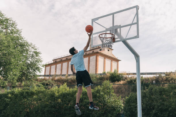 istock Young basketball player making a drop shot in the heights. 1403662529