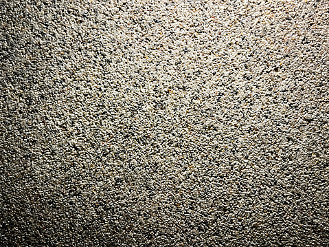 A picture of a wall with small stones as a texture or background.