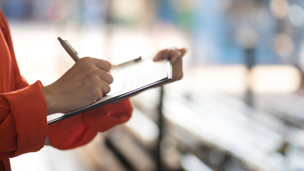 istock Writing on safety checklist document during safety audit and inspection. 1403666194