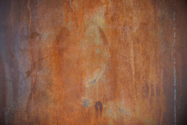 istock rust steel plate background and texture. abstract art rusty wall with dark vignette. 1403669232