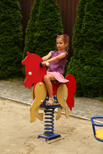 istock Girl on the summer playground 1403670487