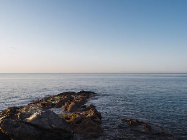 Sunrise by the Mediterranean Sea with a clear sky. vacation concept