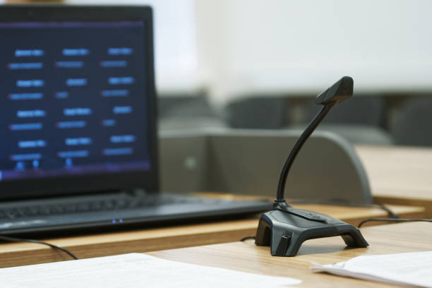 istock Microphone and video camera next to the included laptop. Communication via the Internet. Preparing for video chat. On-line conference. Selective focusing 1403673916