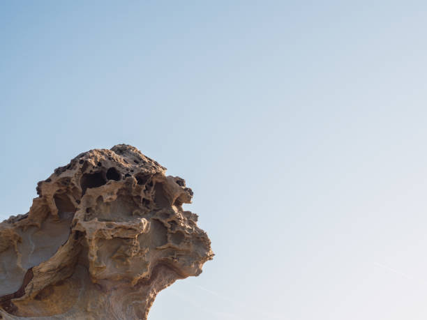 istock Weathered rock with copy space and clear sky. geology concept 1403674763