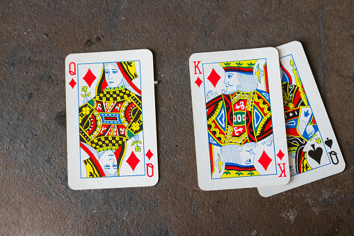 Detail of Ace of hearts card on wooden table