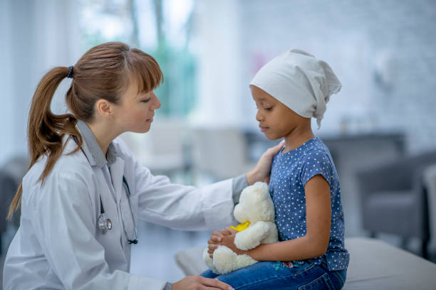istock Young Oncology Patient Sits with Her Doctor During an Exam 1403676087