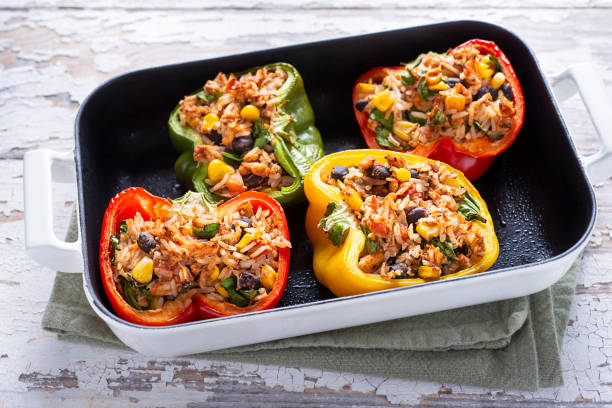 Southwestern Stuffed Peppers Southwestern Stuffed Peppers with Chicken, Rice, Black Beans, Tomato and Corn hungarian pepper stock pictures, royalty-free photos & images
