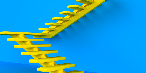 Abstract ladder concept for achievement and success in business or education. Yellow ladder in front of blue wall with copy space.