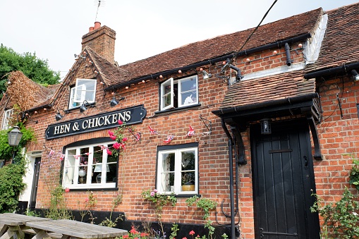 Rye, England - June 13, 2023: A historic town centre English pub, dating back to the 15th Century, situated in the heart of Rye town.