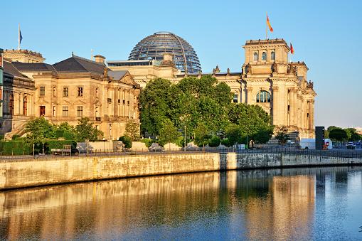 Rear view of the Reichstag as seen at morning from across the Spree river
