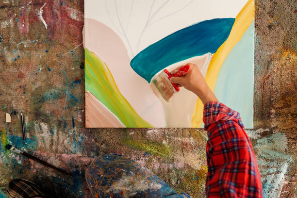 istock Unrecognizable male hand painting canvas 1403680268