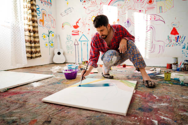 istock Mid adult man painting in art studio 1403680321