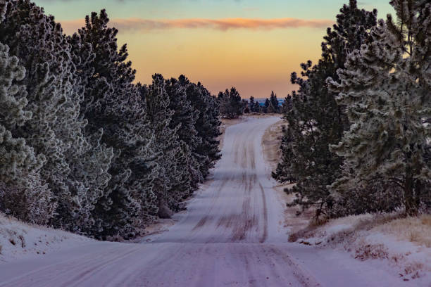 Central Montana prairie hills sunset with snow covered ground in northwestern USA. Nearby towns are Roundup, Lavina, Ryegate, Billings.