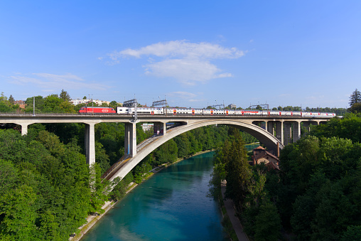 SBB train crossing Lorraine Railway Viaduct over River Aare on a sunny summer day. Photo taken June 16th, 2022, Bern, Switzerland.