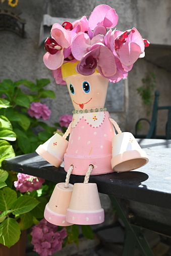 Pink doll created with plant pot