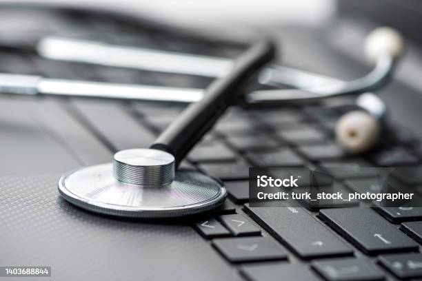 Stethoscope On Laptop Keyboard Healthcare And Medicine Concepts Stock Photo - Download Image Now