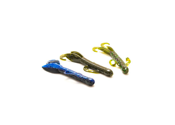 istock Three plastic critter lures for swimming creature bait isolated on white background 1403689139