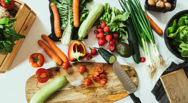istock Table Top View of Kitchen Table Full with Organic Vegetables 1403689273