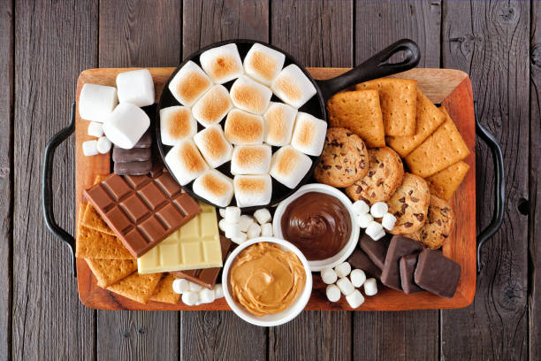 istock Smores platter above view on a dark wood background 1403689385