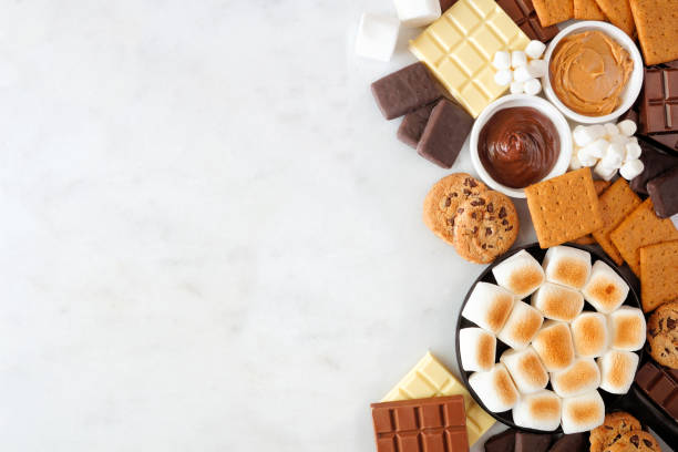 istock Smores buffet side border over a white marble background 1403689578