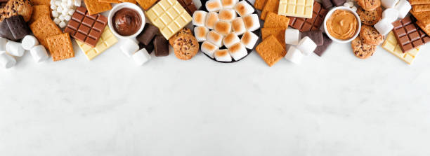 istock Smores buffet top border over a white marble background 1403689923