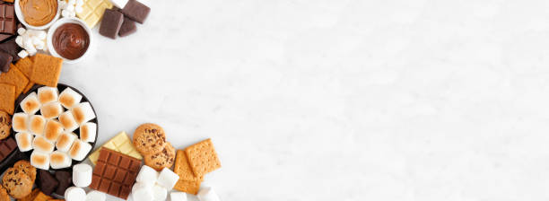 istock Smores buffet corner border over a white marble background 1403689945