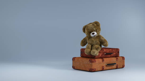 istock teddy bear sitting on vintage suitcase, 3d rendering 1403689973