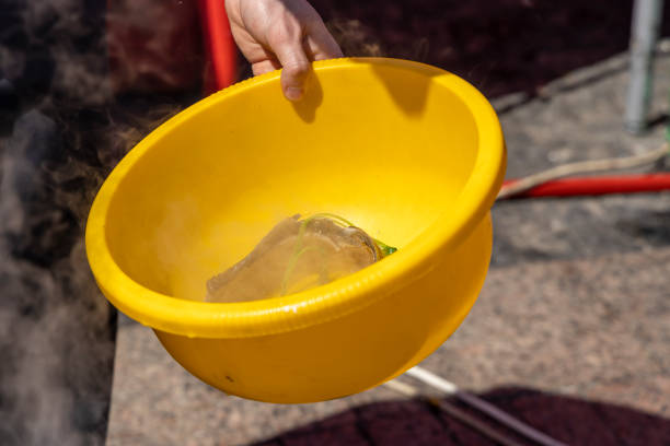 istock The cook puts the boiled fish from the cauldron where the ear is cooked into a basin 1403691286