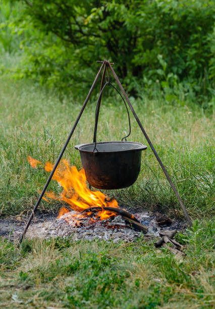 istock a pot in which soup is cooked on a tripod stands on a fire 1403691718
